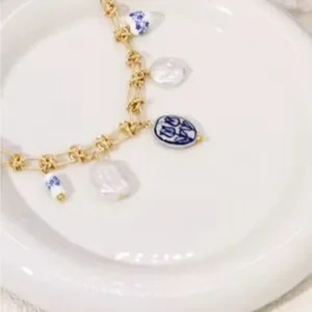 New Anthropologe Gold and Blue Charm Necklace